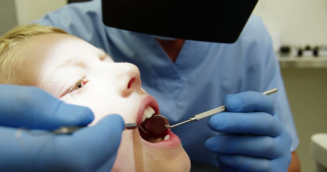 Dental Exam of Child in Clinic by Professional Dentist - Free Images, Stock Photos and Pictures on Pikwizard.com