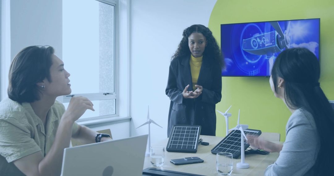 Renewable Energy Meeting with Diverse Team and Modern Technology