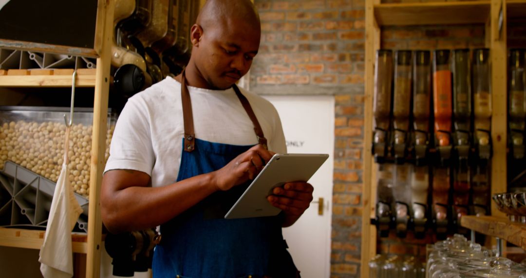 Supermarket Staff Managing Inventory with Digital Tablet