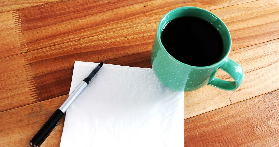 Coffee Cup with Notepad and Pen on Wooden Surface - Free Images, Stock Photos and Pictures on Pikwizard.com