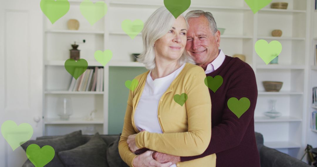 Happy Senior Couple Embracing with Love Hearts Background