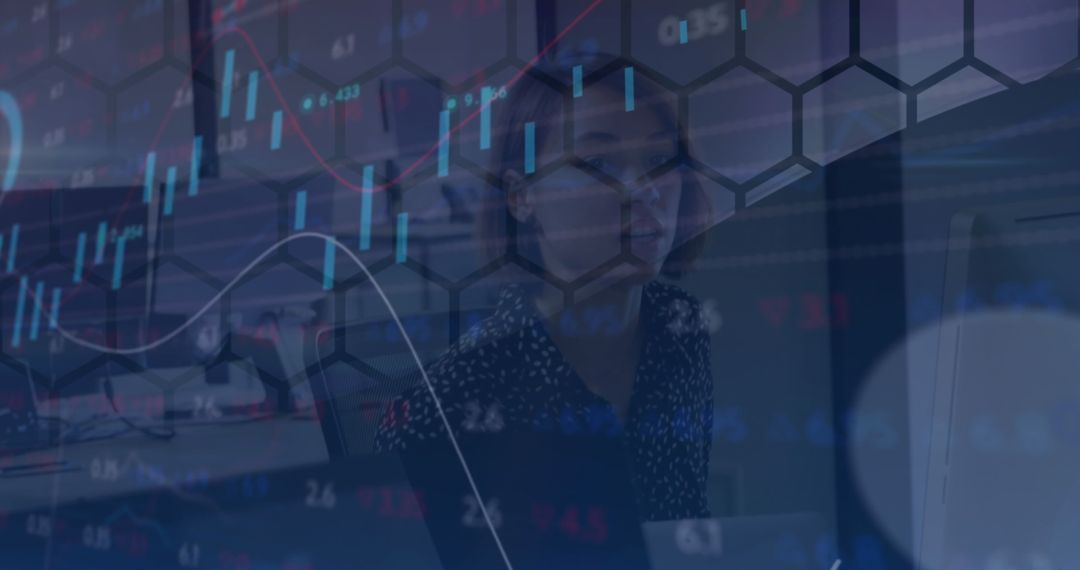 Businesswoman Analyzing Graphs and Data in Modern Workspace