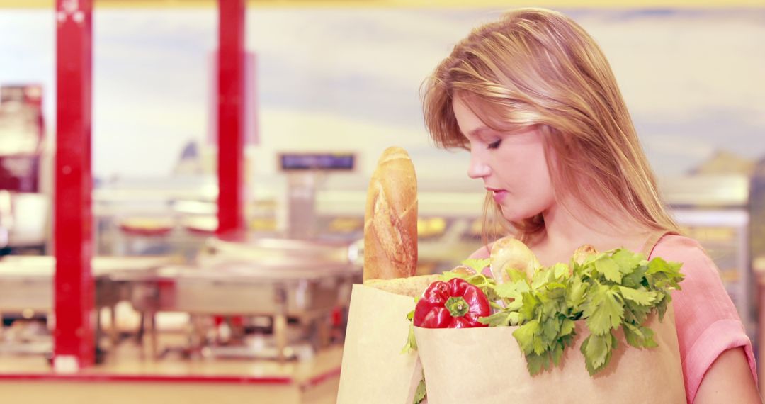 Woman Holding Grocery Bags in Supermarket - Free Images, Stock Photos and Pictures on Pikwizard.com