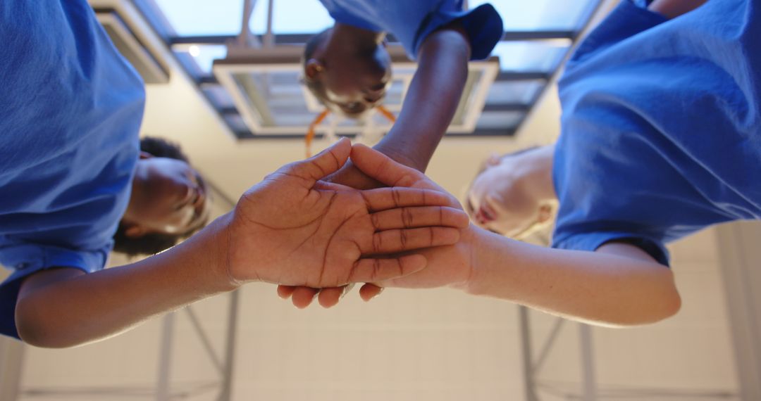 Diverse Female Youth Team Demonstrates Unity and Teamwork in Sports Setting