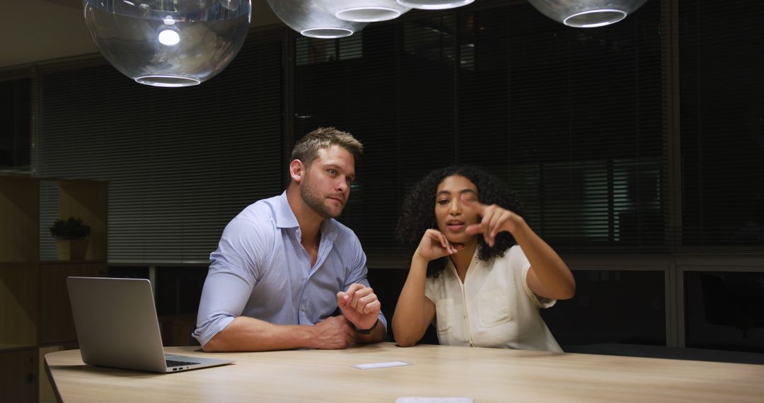 Diverse Team Collaborating on Late-night Office Project