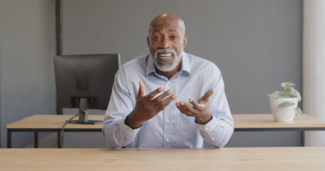 Confident Businessman Explaining Ideas with Expressive Hand Gestures