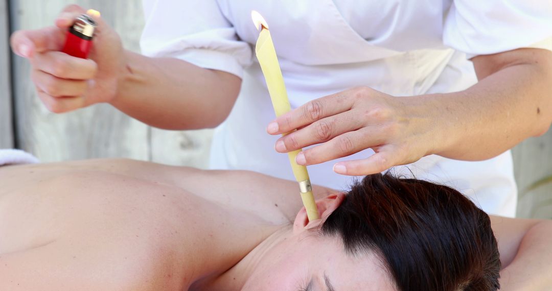 Therapist Conducting Ear Candling Treatment - Free Images, Stock Photos and Pictures on Pikwizard.com