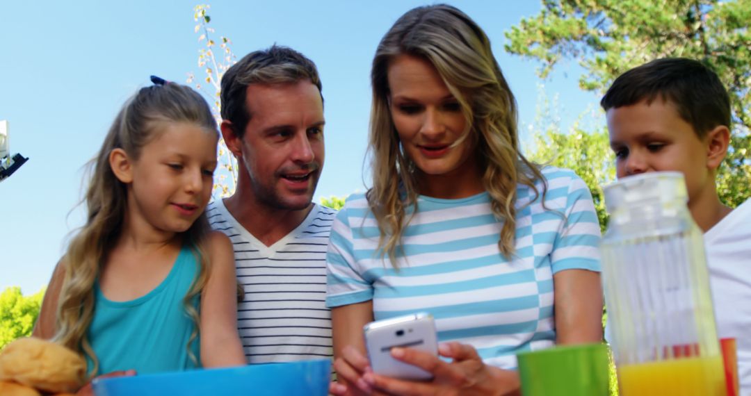 Family Taking Selfie in Sunny Garden - Free Images, Stock Photos and Pictures on Pikwizard.com