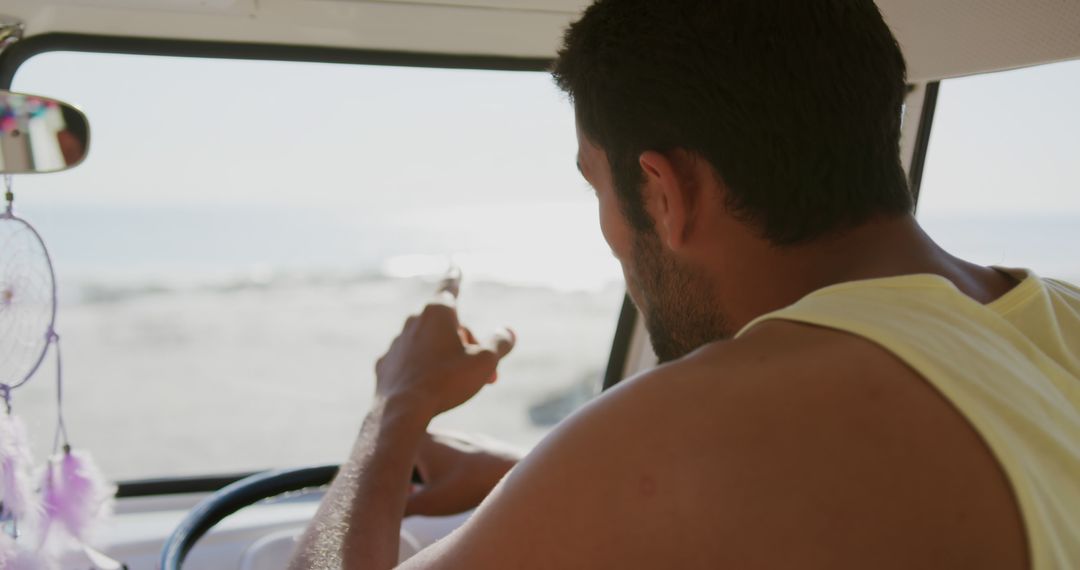 Man Driving Van Near Beach Pointing Towards Sea View Summer Journey - Free Images, Stock Photos and Pictures on Pikwizard.com