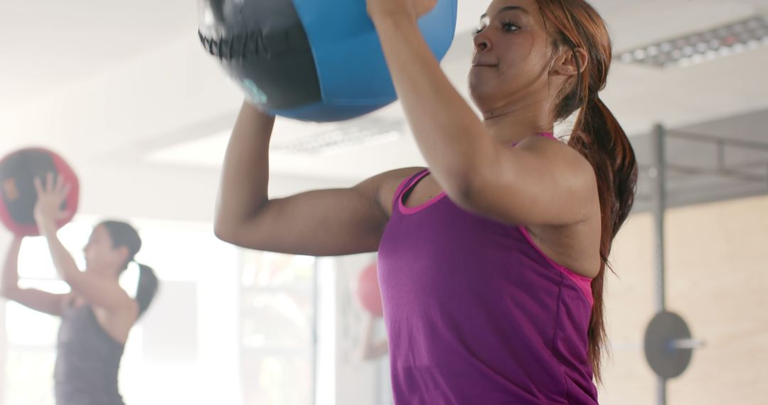 Women Exercising with Medicine Balls in Modern Gym - Free Images, Stock Photos and Pictures on Pikwizard.com