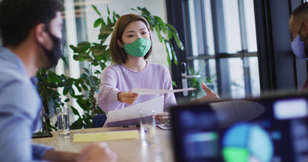 Diverse Team Collaborating with Masks During Pandemic