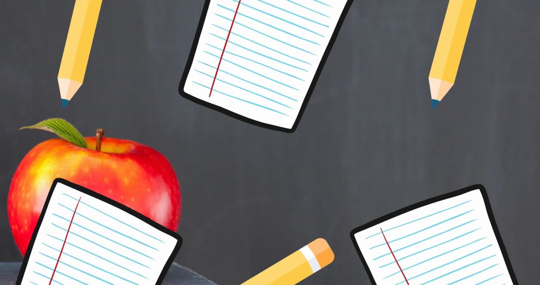 School Essentials with Apple and Paper on Blackboard