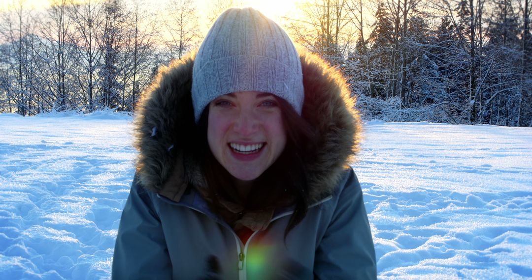 Woman Enjoying Winter Outdoors in Warm Clothing with Snowy Background - Free Images, Stock Photos and Pictures on Pikwizard.com