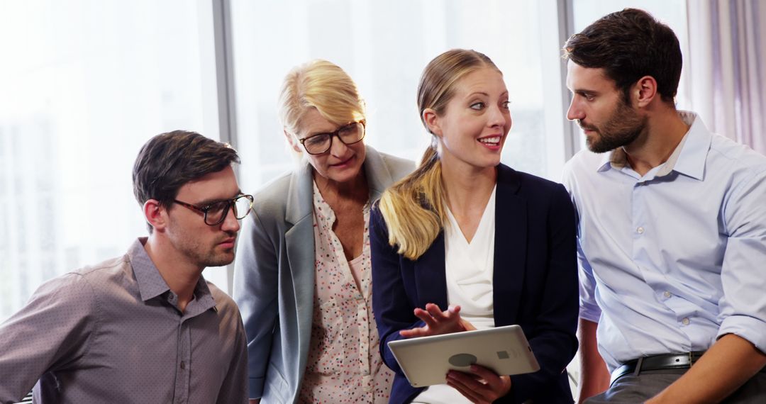 Business Team Collaborating Over Digital Tablet