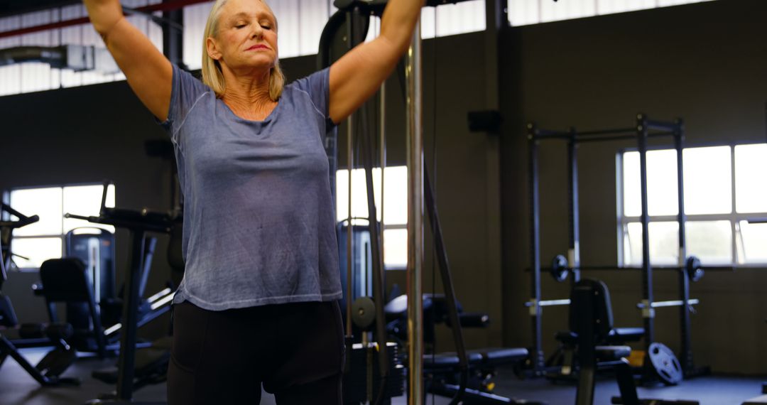 Senior Woman Exercising in Modern Gym - Free Images, Stock Photos and Pictures on Pikwizard.com