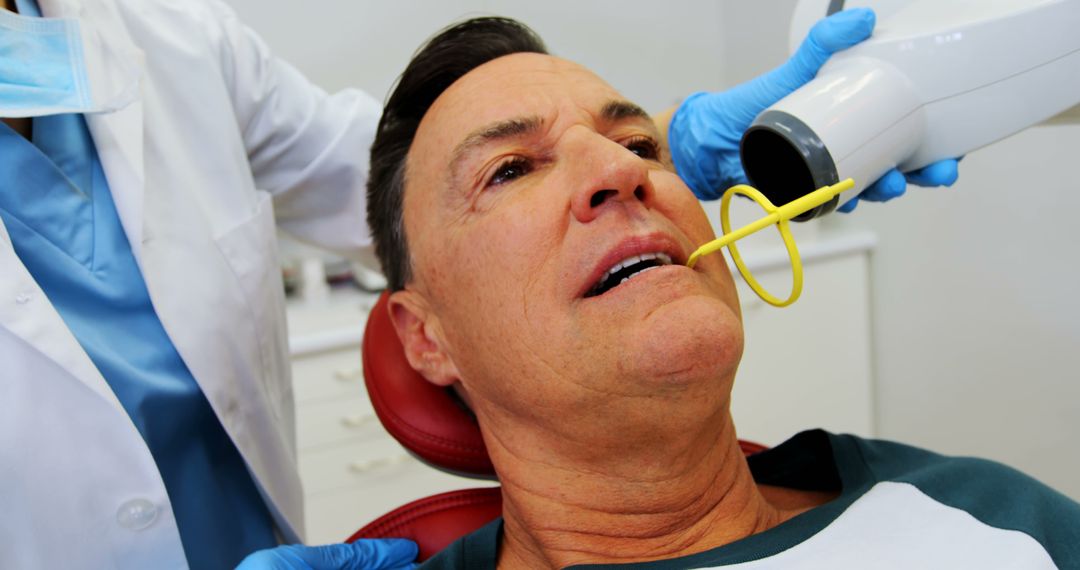 Mature patient receiving dental treatment with advanced technology - Free Images, Stock Photos and Pictures on Pikwizard.com