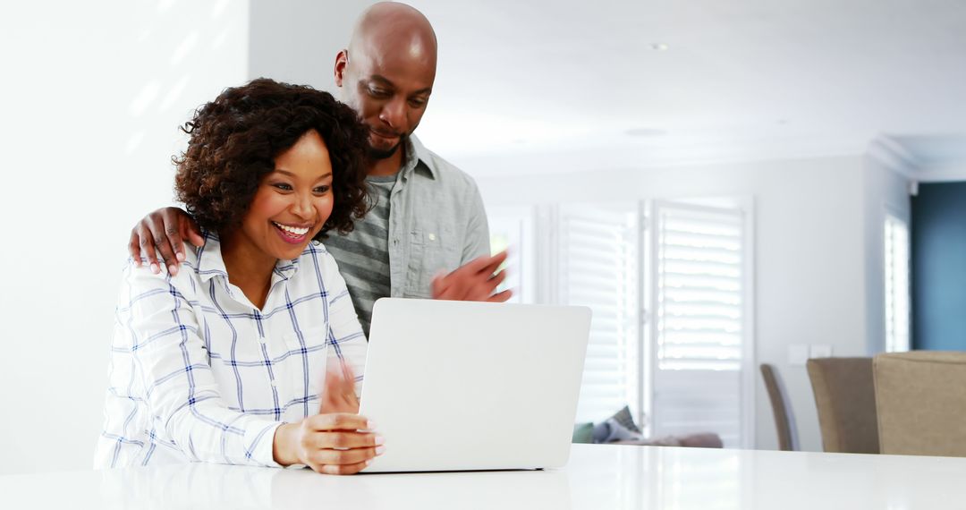 Happy Couple Sharing Laughter Exploring Laptop