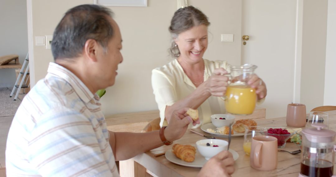 Senior Couple Enjoying Cozy Breakfast at Home