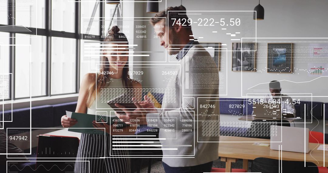 Professionals Reviewing Data on Screen in Modern Office