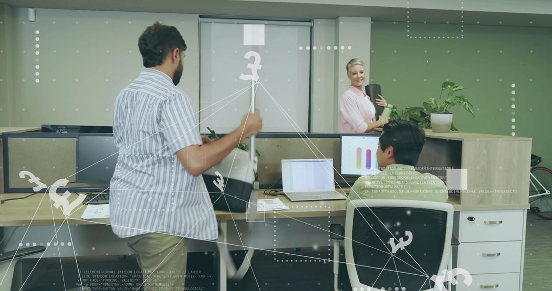 Coworkers Collaborating in Modern Office with Laptops