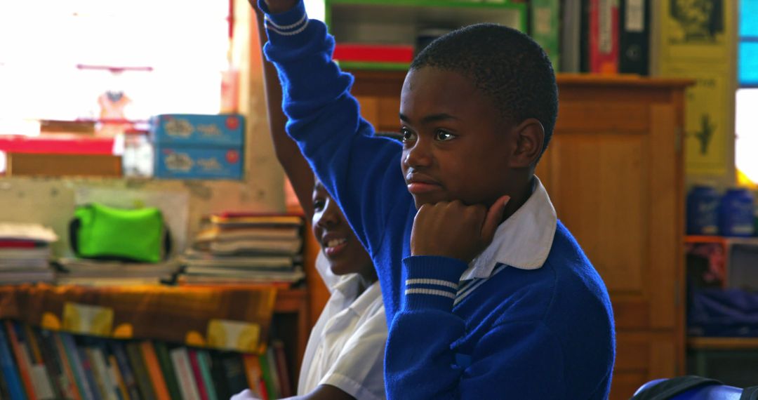 African Student Raising Hand in Classroom Discussion - Free Images, Stock Photos and Pictures on Pikwizard.com