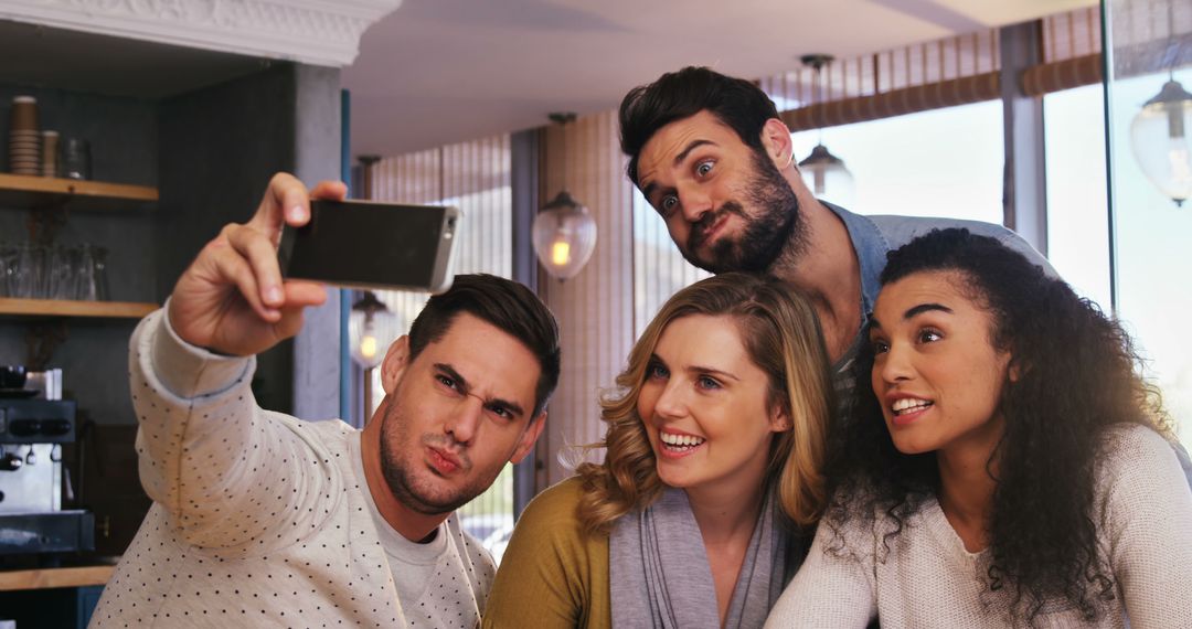 Friends Taking a Group Selfie in Cafe - Free Images, Stock Photos and Pictures on Pikwizard.com