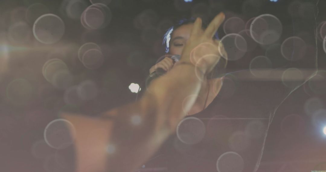 Singer Engaging Audience with Passion and Energized Stage Performance