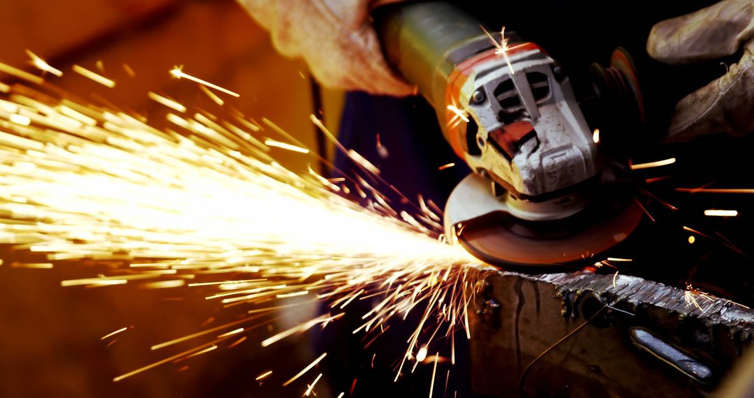 Worker Using Angle Grinder with Sparks Flying - Free Images, Stock Photos and Pictures on Pikwizard.com