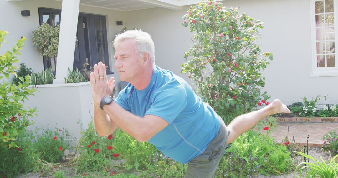 Image of relaxed caucasian senior man practicing yoga in front of house - Free Images, Stock Photos and Pictures on Pikwizard.com