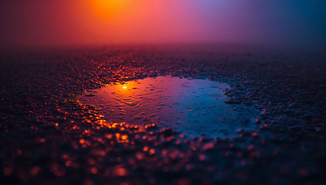 Neon Orange Reflection in Puddle on Wet Asphalt, Abstract Urban Vibes