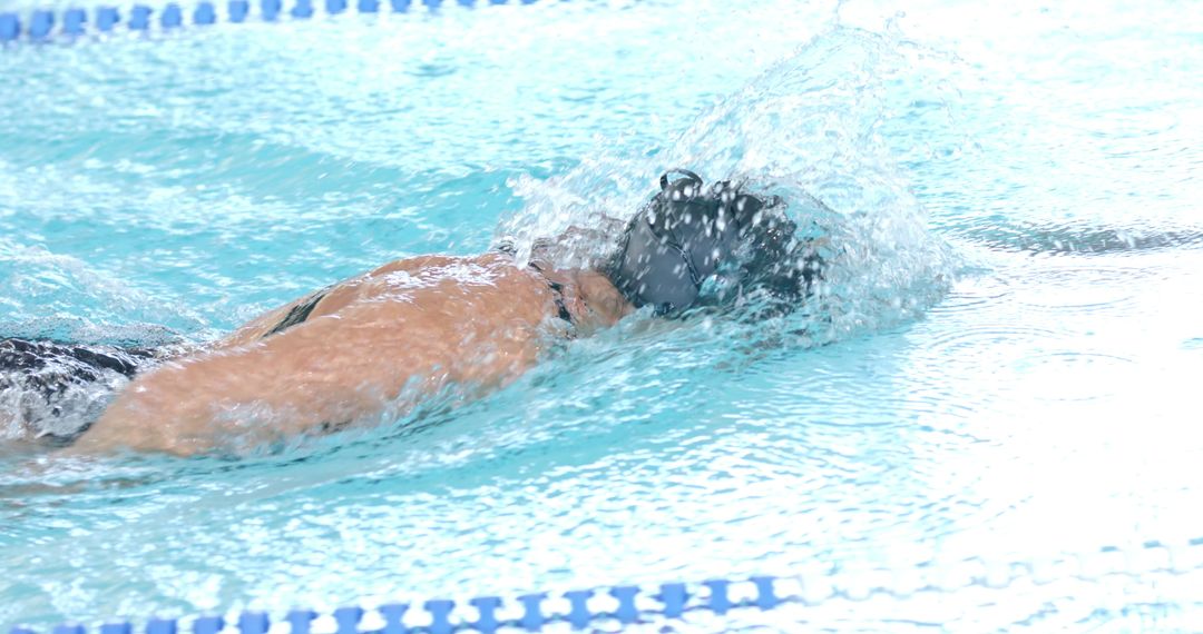 Competitive Swimmer Gliding Through Pool Water with Streamlined Grace
