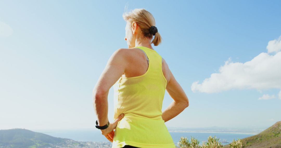 Middle-aged Woman Viewing Scenic Landscape during Outdoors Exercise - Free Images, Stock Photos and Pictures on Pikwizard.com