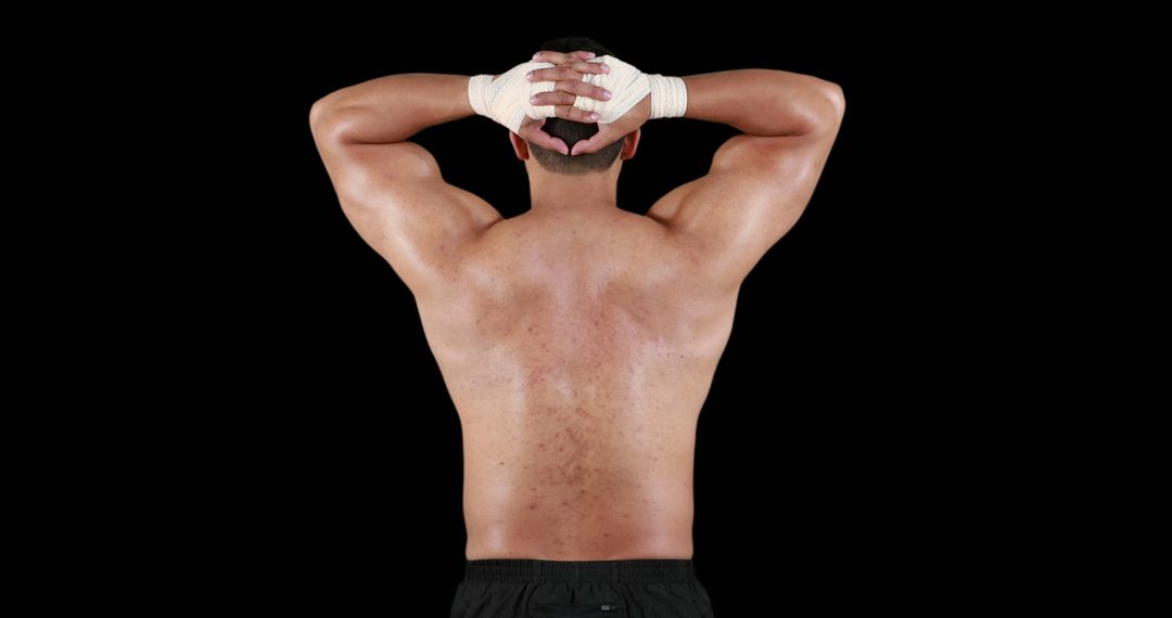 Athlete Resting Displaying Muscular Back in Contemplation