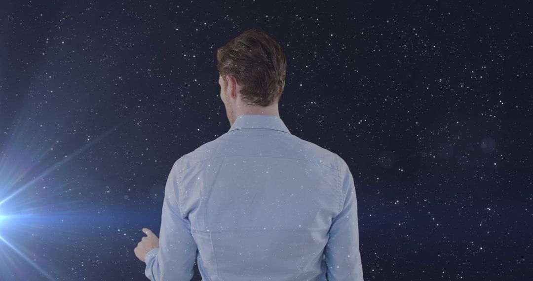 Man Using VR Headset Against Starry Night Sky