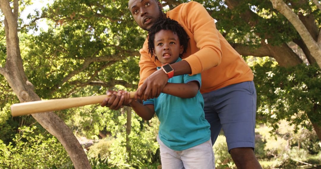 Father Teaching Son Baseball in Park Setting - Free Images, Stock Photos and Pictures on Pikwizard.com