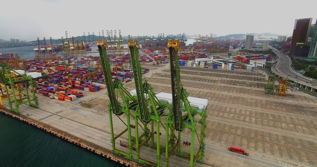 Green Gantry Cranes Operating at Bustling Seaport