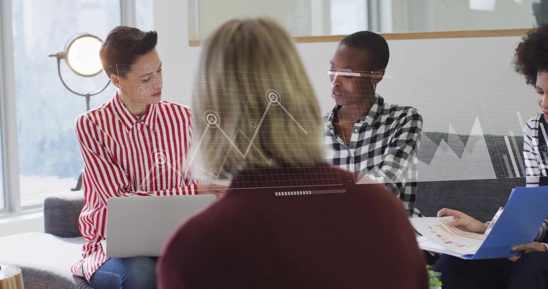 Diverse Team Collaborates Using Data Visualizations in Office