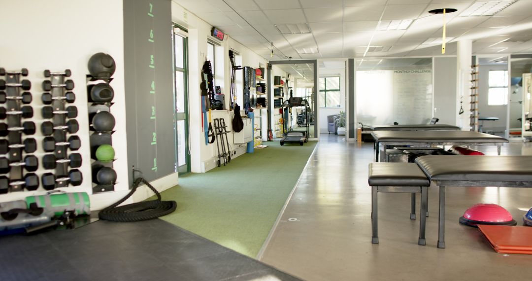 Rehabilitation Center with Exercise Equipment and Therapy Tables
