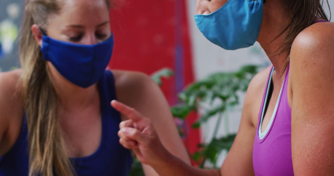 Women Having Outdoor Conversation While Wearing Masks - Free Images, Stock Photos and Pictures on Pikwizard.com