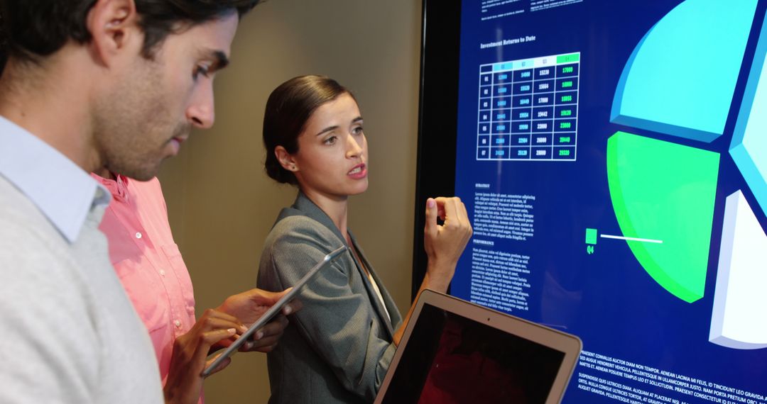 Business team analyzing data on large screen in office - Free Images, Stock Photos and Pictures on Pikwizard.com