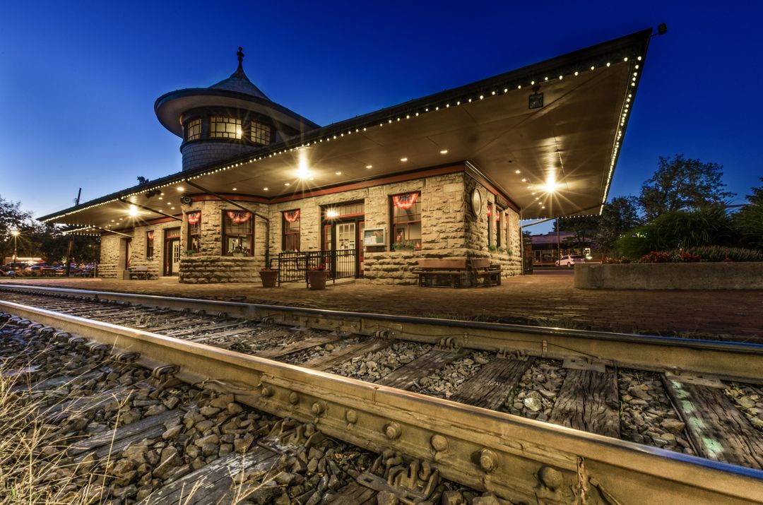 Historic Train Station at Dusk with Illuminated Lights - Free Images, Stock Photos and Pictures on Pikwizard.com