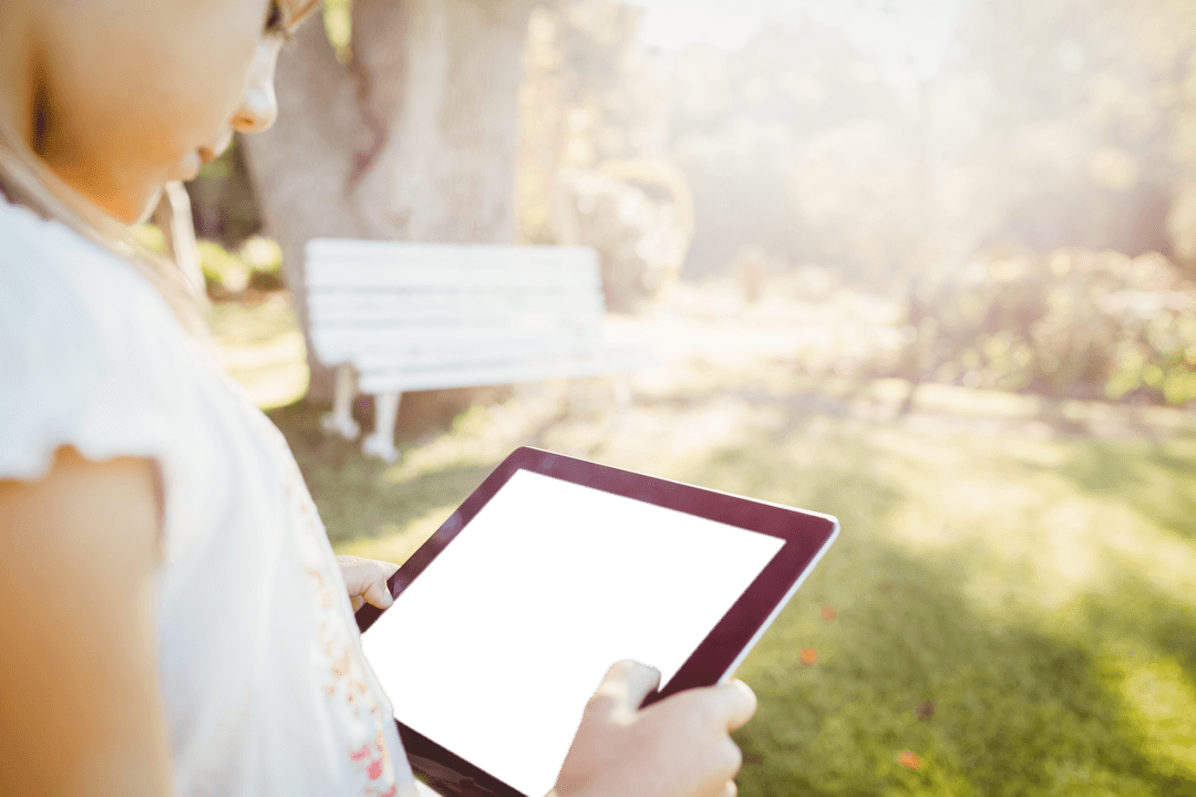 Transparent Screen Tablet Used by Child Outdoors in Sunshine