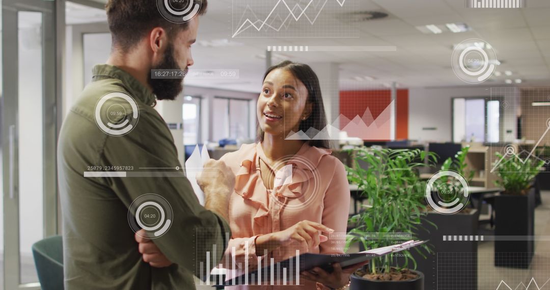 Business Professionals Analyzing Data with Digital Projections in Office