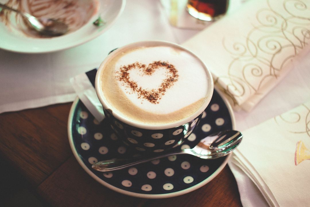 Heart-shaped Latte Art in Polka Dot Cup on Wooden Table - Free Images, Stock Photos and Pictures on Pikwizard.com