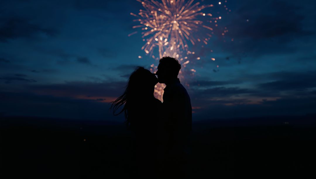 Silhouetted Couple Kissing Under Fireworks at Dusk