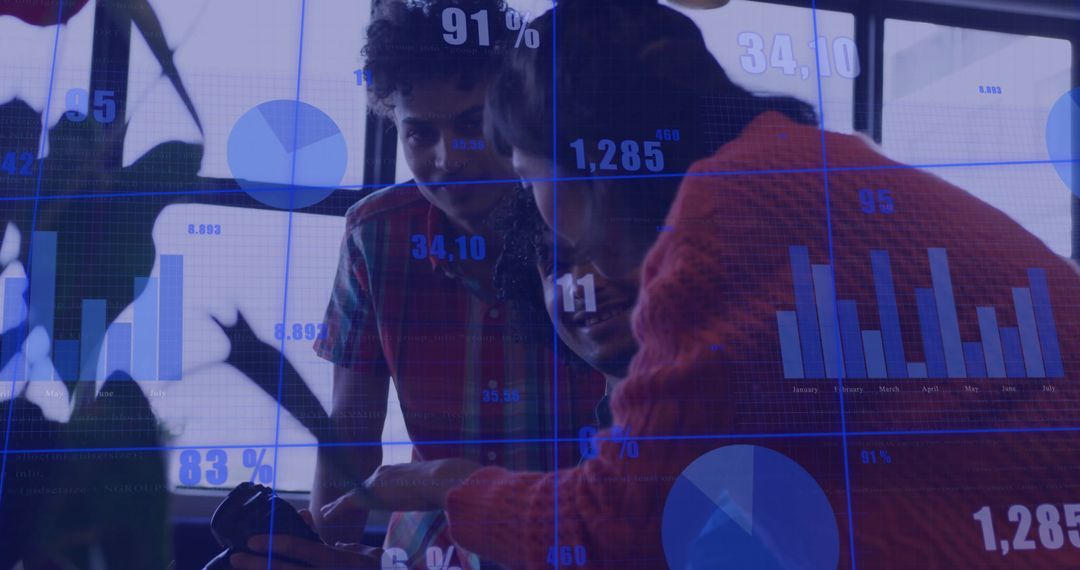 Two Colleagues Analyzing Data on Smartphone in Office