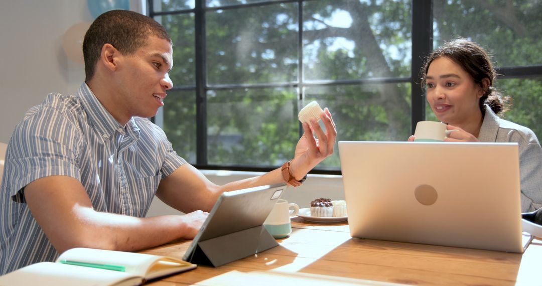 Colleagues Enjoying Coffee and Cupcake in Modern Office