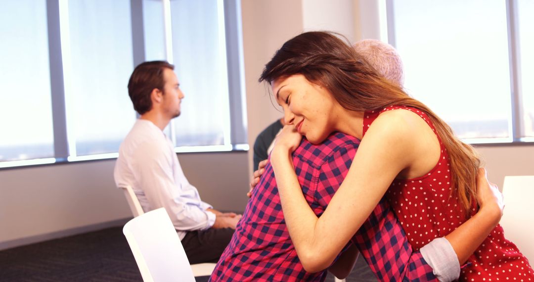 Supportive Group Hug in Therapy Session - Free Images, Stock Photos and Pictures on Pikwizard.com