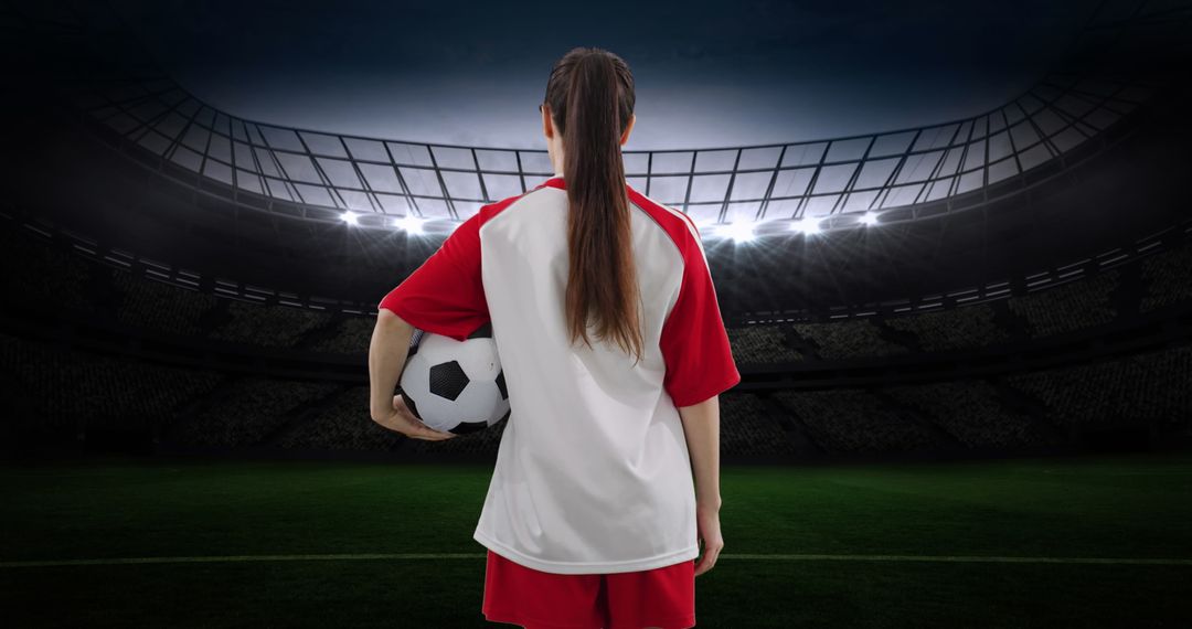 Female Soccer Player Standing Stadium with Bright Lights