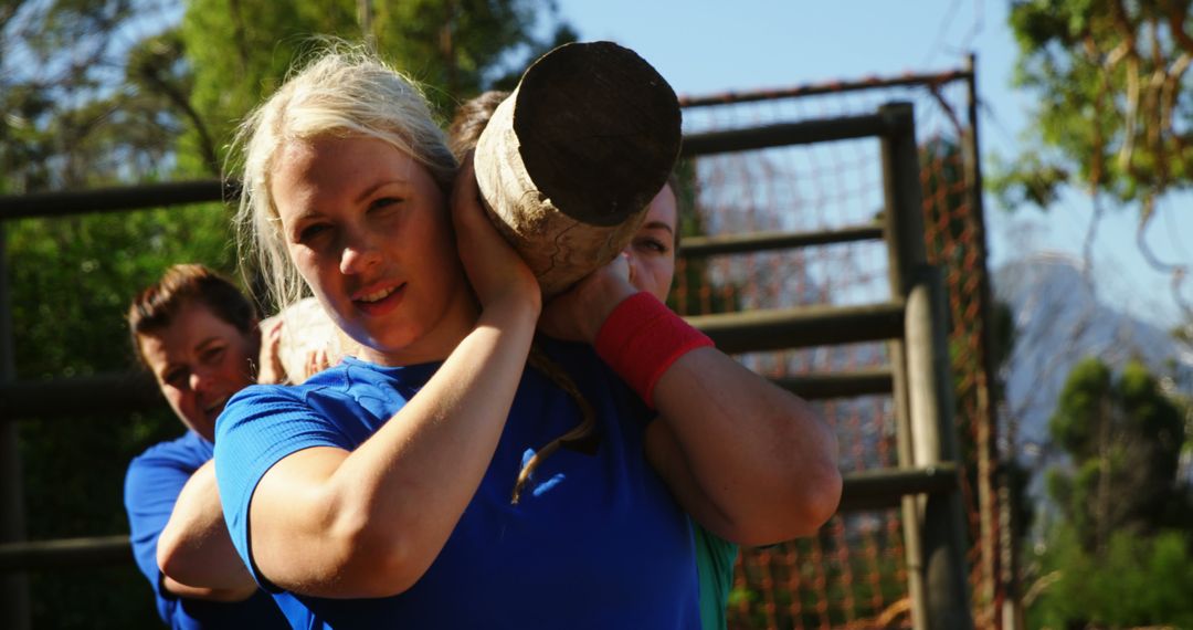 Women Carrying Heavy Log During Outdoor Team Exercise - Free Images, Stock Photos and Pictures on Pikwizard.com